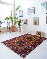 Vintage Turkish rug in a living room setting, pile rug, Turkish rug, vintage rug, portland, rug shop, bright colors, wild shaman, soft rug, bold color, Portland, Oregon, rug store, rug shop, local shop, antique rug