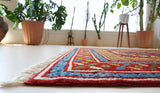 Vintage Turkish rug in a living room setting, pile rug, Turkish rug, vintage rug, portland, rug shop, bright colors, wild shaman, soft rug, bold color, Portland, Oregon, rug store, rug shop, local shop, antique rug