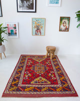 Vintage Turkish rug in a living room setting, pile rug, Turkish rug, vintage rug, portland, rug shop, bright colors, wild shaman, soft rug, bold color, Portland, Oregon, rug store, rug shop, local shop, antique rug