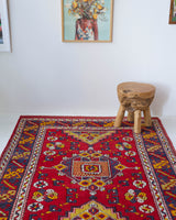 Vintage Turkish rug in a living room setting, pile rug, Turkish rug, vintage rug, portland, rug shop, bright colors, wild shaman, soft rug, bold color, Portland, Oregon, rug store, rug shop, local shop, antique rug