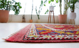 Vintage Turkish rug in a living room setting, pile rug, Turkish rug, vintage rug, portland, rug shop, bright colors, wild shaman, soft rug, bold color, Portland, Oregon, rug store, rug shop, local shop, antique rug