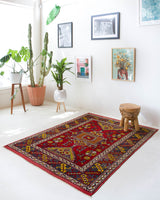 Vintage Turkish rug in a living room setting, pile rug, Turkish rug, vintage rug, portland, rug shop, bright colors, wild shaman, soft rug, bold color, Portland, Oregon, rug store, rug shop, local shop, antique rug