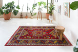 Vintage Turkish rug in a living room setting, pile rug, Turkish rug, vintage rug, portland, rug shop, bright colors, wild shaman, soft rug, bold color, Portland, Oregon, rug store, rug shop, local shop, antique rug