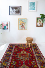 Vintage Turkish rug in a living room setting, pile rug, Turkish rug, vintage rug, portland, rug shop, bright colors, wild shaman, soft rug, bold color, Portland, Oregon, rug store, rug shop, local shop, antique rug