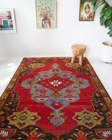 Vintage Turkish rug in a living room setting, pile rug, Turkish rug, vintage rug, portland, rug shop, bright colors, wild shaman, soft rug, bold color, Portland, Oregon, rug store, rug shop, local shop, antique rug