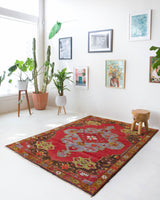 Vintage Turkish rug in a living room setting, pile rug, Turkish rug, vintage rug, portland, rug shop, bright colors, wild shaman, soft rug, bold color, Portland, Oregon, rug store, rug shop, local shop, antique rug