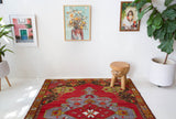 Vintage Turkish rug in a living room setting, pile rug, Turkish rug, vintage rug, portland, rug shop, bright colors, wild shaman, soft rug, bold color, Portland, Oregon, rug store, rug shop, local shop, antique rug