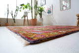 Vintage Turkish rug in a living room setting, pile rug, Turkish rug, vintage rug, portland, rug shop, bright colors, wild shaman, soft rug, bold color, Portland, Oregon, rug store, rug shop, local shop, antique rug