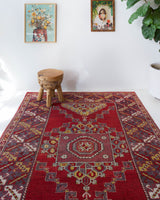 Vintage Turkish rug in a living room setting, pile rug, Turkish rug, vintage rug, portland, rug shop, bright colors, wild shaman, soft rug, bold color, Portland, Oregon, rug store, rug shop, local shop, antique rug