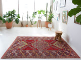 Vintage Turkish rug in a living room setting, pile rug, Turkish rug, vintage rug, portland, rug shop, bright colors, wild shaman, soft rug, bold color, Portland, Oregon, rug store, rug shop, local shop, antique rug