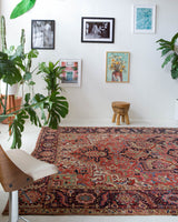 Antique Persian area rug in a living room setting, pile rug, Turkish rug, old rug, antique rug, pastel colors, faded colors, Turkish rug, vintage rug, soft rug, Portland, Oregon, rug store, rug shop, local shop, distressed rug, worn out rug