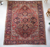 Antique Persian area rug in a living room setting, pile rug, Turkish rug, old rug, antique rug, pastel colors, faded colors, Turkish rug, vintage rug, soft rug, Portland, Oregon, rug store, rug shop, local shop, distressed rug, worn out rug