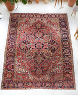 Antique Persian area rug in a living room setting, pile rug, Turkish rug, old rug, antique rug, pastel colors, faded colors, Turkish rug, vintage rug, soft rug, Portland, Oregon, rug store, rug shop, local shop, distressed rug, worn out rug