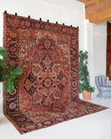 Antique Persian area rug in a living room setting, pile rug, Turkish rug, old rug, antique rug, pastel colors, faded colors, Turkish rug, vintage rug, soft rug, Portland, Oregon, rug store, rug shop, local shop, distressed rug, worn out rug