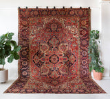 Antique Persian area rug in a living room setting, pile rug, Turkish rug, old rug, antique rug, pastel colors, faded colors, Turkish rug, vintage rug, soft rug, Portland, Oregon, rug store, rug shop, local shop, distressed rug, worn out rug