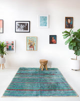 Vintage Turkish rug in living room setting, old rug, antique rug, pastel colors, faded colors, Turkish rug, vintage rug, soft rug, Portland, Oregon, rug store, rug shop, local shop