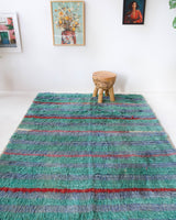 Vintage Turkish rug in living room setting, old rug, antique rug, pastel colors, faded colors, Turkish rug, vintage rug, soft rug, Portland, Oregon, rug store, rug shop, local shop