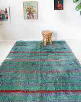 Vintage Turkish rug in living room setting, old rug, antique rug, pastel colors, faded colors, Turkish rug, vintage rug, soft rug, Portland, Oregon, rug store, rug shop, local shop