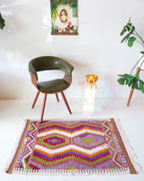 Vintage kilim rug in room decor setting, old rug, antique rug, pastel colors, faded colors, Turkish rug, vintage rug, soft rug, Portland, Oregon, rug store, rug shop, local shop