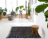 Vintage Turkish rug in a living room setting, pile rug, Turkish rug, vintage rug, portland, rug shop, bright colors, wild shaman, soft rug, bold color, Portland, Oregon, rug store, rug shop, local shop