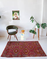Vintage kilim rug in room decor setting, kilim, Turkish rug, vintage rug, portland, rug shop, bright colors, wild shaman, soft rug, bold color, Portland, Oregon, rug store, rug shop, local shop, antique rug