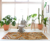 Vintage Turkish runner rug in living room setting, old rug, antique rug, pastel colors, faded colors, Turkish rug, vintage rug, soft rug, Portland, Oregon, rug store, rug shop, local shop