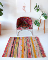 Vintage kilim rug in room decor setting, old rug, antique rug, pastel colors, faded colors, Turkish rug, vintage rug, soft rug, Portland, Oregon, rug store, rug shop, local shop