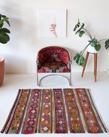 Vintage mini kilim rug in room decor setting, kilim, Turkish rug, vintage rug, portland, rug shop, bright colors, wild shaman, soft rug, bold color, Portland, Oregon, rug store, rug shop, local shop