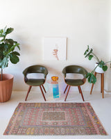 Vintage kilim rug in room decor setting, old rug, antique rug, pastel colors, faded colors, Turkish rug, vintage rug, soft rug, Portland, Oregon, rug store, rug shop, local shop, distressed rug, worn out rug