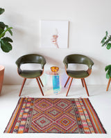 Vintage kilim rug in room decor setting, old rug, antique rug, pastel colors, faded colors, Turkish rug, vintage rug, soft rug, Portland, Oregon, rug store, rug shop, local shop