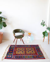 Vintage kilim rug in room decor setting, kilim, Turkish rug, vintage rug, portland, rug shop, bright colors, wild shaman, soft rug, bold color, Portland, Oregon, rug store, rug shop, local shop, antique rug