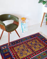 Vintage kilim rug in room decor setting, kilim, Turkish rug, vintage rug, portland, rug shop, bright colors, wild shaman, soft rug, bold color, Portland, Oregon, rug store, rug shop, local shop, antique rug