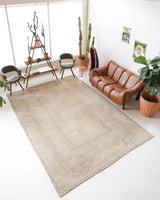 Vintage Turkish rug in living room setting, old rug, antique rug, pastel colors, faded colors, Turkish rug, vintage rug, soft rug, Portland, Oregon, rug store, rug shop, local shop