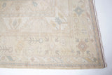 Vintage Turkish rug in living room setting, old rug, antique rug, pastel colors, faded colors, Turkish rug, vintage rug, soft rug, Portland, Oregon, rug store, rug shop, local shop