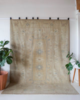 Vintage Turkish rug in living room setting, old rug, antique rug, pastel colors, faded colors, Turkish rug, vintage rug, soft rug, Portland, Oregon, rug store, rug shop, local shop