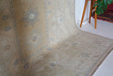 Vintage Turkish rug in living room setting, old rug, antique rug, pastel colors, faded colors, Turkish rug, vintage rug, soft rug, Portland, Oregon, rug store, rug shop, local shop