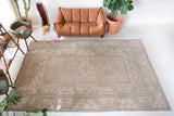 Vintage Turkish rug in living room setting, old rug, antique rug, pastel colors, faded colors, Turkish rug, vintage rug, soft rug, Portland, Oregon, rug store, rug shop, local shop