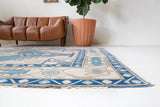 Vintage Turkish rug in living room setting, old rug, antique rug, pastel colors, faded colors, Turkish rug, vintage rug, soft rug, Portland, Oregon, rug store, rug shop, local shop