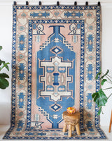 Vintage Turkish rug in living room setting, old rug, antique rug, pastel colors, faded colors, Turkish rug, vintage rug, soft rug, Portland, Oregon, rug store, rug shop, local shop