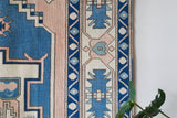 Vintage Turkish rug in living room setting, old rug, antique rug, pastel colors, faded colors, Turkish rug, vintage rug, soft rug, Portland, Oregon, rug store, rug shop, local shop