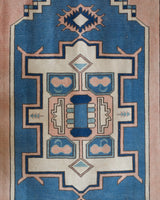 Vintage Turkish rug in living room setting, old rug, antique rug, pastel colors, faded colors, Turkish rug, vintage rug, soft rug, Portland, Oregon, rug store, rug shop, local shop
