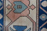 Vintage Turkish rug in living room setting, old rug, antique rug, pastel colors, faded colors, Turkish rug, vintage rug, soft rug, Portland, Oregon, rug store, rug shop, local shop