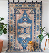 Vintage Turkish rug in living room setting, old rug, antique rug, pastel colors, faded colors, Turkish rug, vintage rug, soft rug, Portland, Oregon, rug store, rug shop, local shop