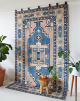 Vintage Turkish rug in living room setting, old rug, antique rug, pastel colors, faded colors, Turkish rug, vintage rug, soft rug, Portland, Oregon, rug store, rug shop, local shop