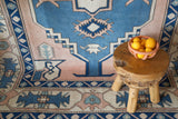 Vintage Turkish rug in living room setting, old rug, antique rug, pastel colors, faded colors, Turkish rug, vintage rug, soft rug, Portland, Oregon, rug store, rug shop, local shop