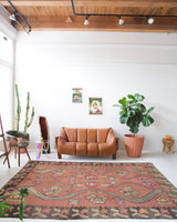 Vintage kilim rug in living room setting, old rug, antique rug, pastel colors, faded colors, Turkish rug, vintage rug, soft rug, Portland, Oregon, rug store, rug shop, local shop