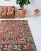 Vintage kilim rug in living room setting, old rug, antique rug, pastel colors, faded colors, Turkish rug, vintage rug, soft rug, Portland, Oregon, rug store, rug shop, local shop