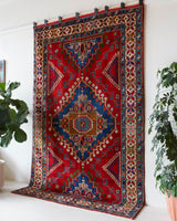 Vintage Turkish rug in a living room setting, pile rug, Turkish rug, vintage rug, portland, rug shop, bright colors, wild shaman, soft rug, bold color, Portland, Oregon, rug store, rug shop, local shop, antique rug