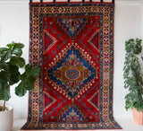 Vintage Turkish rug in a living room setting, pile rug, Turkish rug, vintage rug, portland, rug shop, bright colors, wild shaman, soft rug, bold color, Portland, Oregon, rug store, rug shop, local shop, antique rug