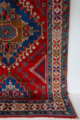 Vintage Turkish rug in a living room setting, pile rug, Turkish rug, vintage rug, portland, rug shop, bright colors, wild shaman, soft rug, bold color, Portland, Oregon, rug store, rug shop, local shop, antique rug